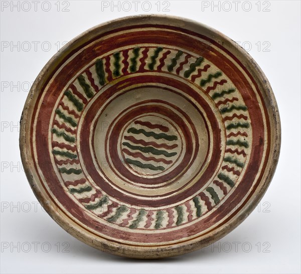 Large plate with yellow, green and ocher-colored decoration in sludge technology, plate dish crockery holder soil find ceramic