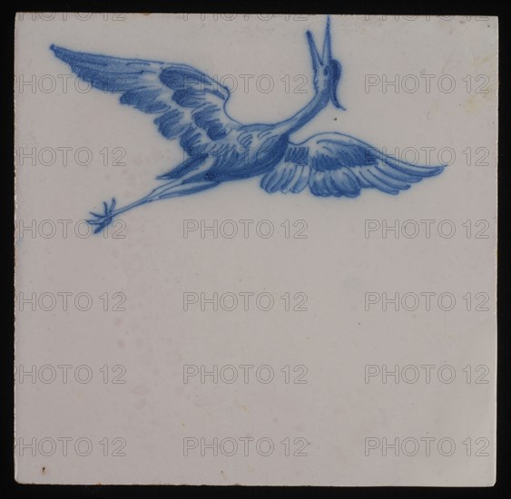 Jan Aalmis sr., Tile, blue on white, with the image of heron with spread wings and with opened beak, wall tile tile sculpture