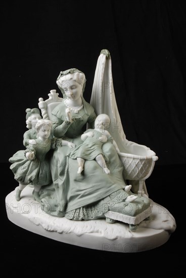 Light green and white colored image of mother with children, on oval floor plan, entitled Maternité, sculpture ceramics