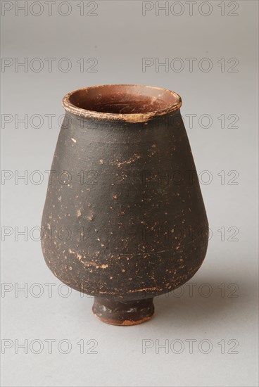 Brown Roman cup on foot, cup drinking utensils tableware holder soil find ceramic pottery paint, hand turned fried varnished