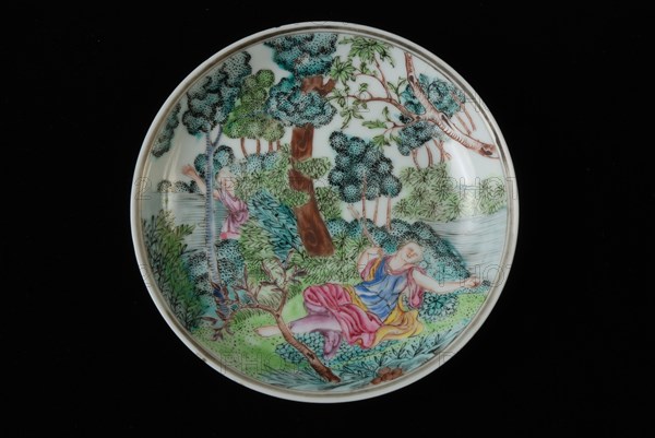 Dish of cup and saucer with lying woman and man in landscape in bushes, cup and saucer drinking utensils tableware holder