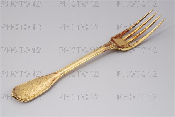 Gold plated fork with four teeth, fork cover cutlery silver gold, forged gilded stem four teeth. Pine cone BW in oval, smashed