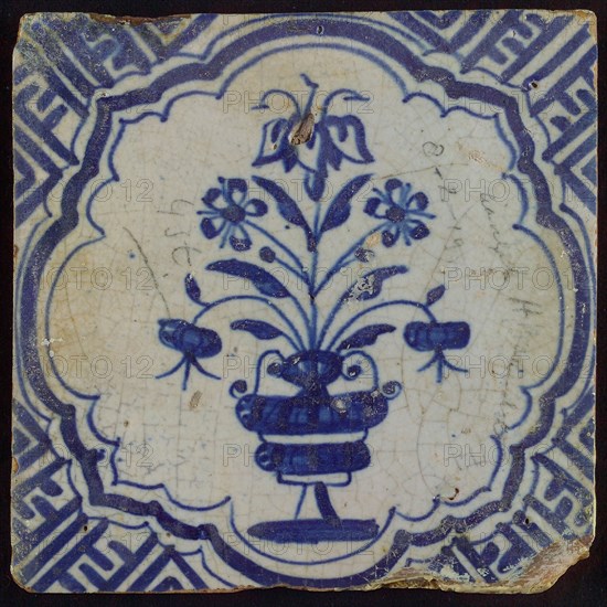 Tile with blue pot with flowers in brace-like frame; corner pattern meander, wall tile tile sculpture ceramic earthenware glaze