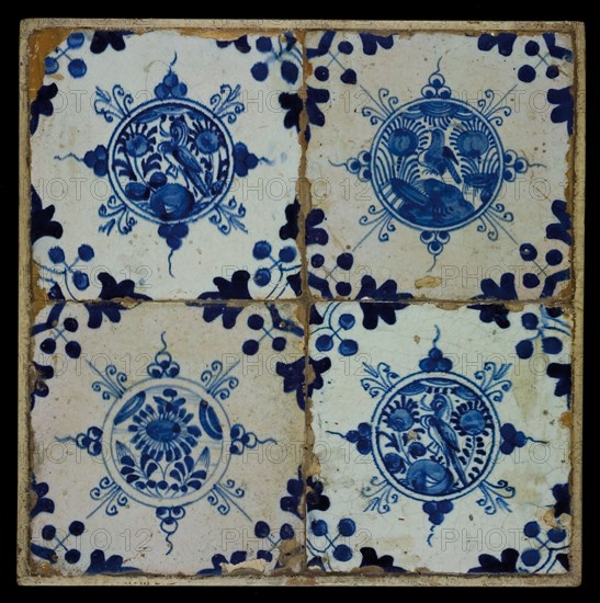 Tile field, four tiles, central decor, blue on white, three times flowers with bird in circle and flower in circle, corner motif