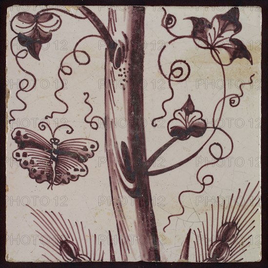 Tile of purple pilaster with tree trunk with curled twigs, leaves, bunches of grapes and around it butterflies and ears of corn