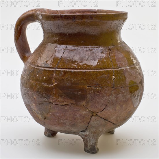 Pottery cooking pot, cooking jug with profile ring on the shoulder, one sausage ear, on three legs, cooking pot tableware holder