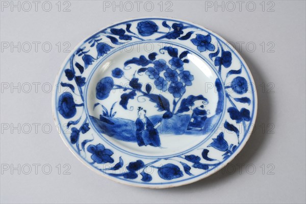 White dish with blue Oriental figure and flowers, dish plate tableware holder ceramic porcelain glaze, baked painted glazed