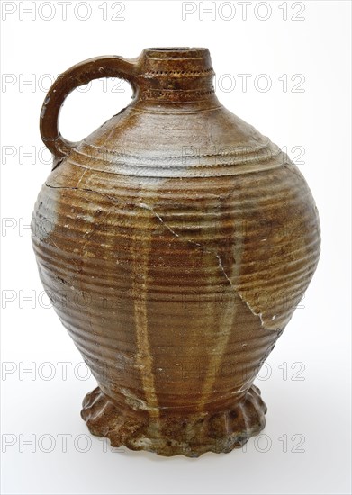 Large stoneware jug on heavy pinched foot, radstamp decoration around neck and shoulder, jug holder kitchen utensils earthenware