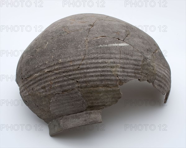 Fragment stock pot on lens bottom, ball round, gray shard, storage jar pot holder fragment earthenware ceramic pottery, hand
