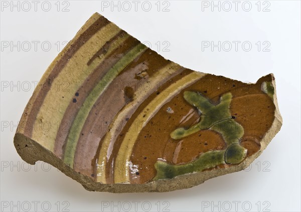 Fragment of small pottery plate or bowl, decorated with arrow decoration in sludge technology, plate container tableware holder