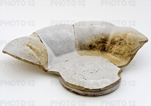 Fragment of white pleated plate on stand, faience, folding dish dish crockery holder fragment soil found ceramic earthenware