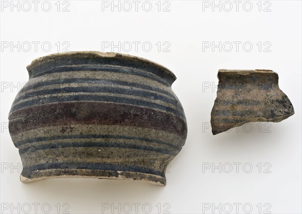 Fragments of majolica ointment jar with polychrome decor, low stomach model, ointment jar apothecary jar holder fragment soil