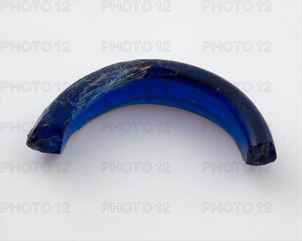 Fragment of glass pendant or ring, dark blue glass, jewelery clothing accessory clothing soil find glass, molten drawn