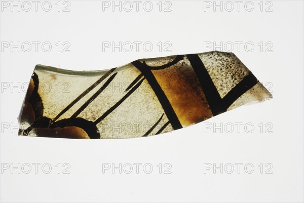 Fragment of green window glass with stained-glass decor, window glass building material soil find glass, w 0.9 cast drawn cut