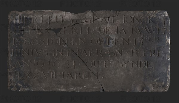 Tombstone with text Here leit engraved ... LXXVII, tombstone found bottom shale stone, chopped Rectangular flat text