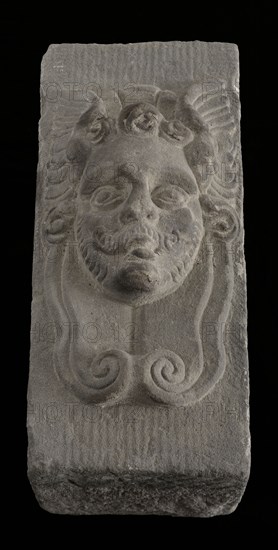 Keystone with gable head, male head with wings (Mercury?), keystone gable ornament building component sandstone stone cement