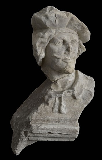 Male head with beret and goatee, sculpture footage limestone stone, sculpted Head of man with mustache goatee and beret.