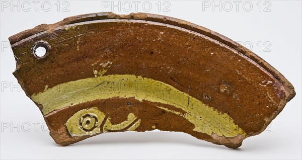 Fragment of earthenware dish on stand fins with bird's head in sludge technology, dish crockery holder soil find ceramic