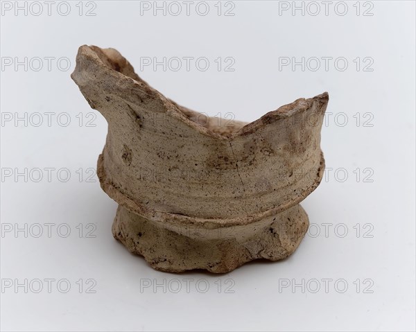 Fragment stoneware mug or bowl on slightly pinched stand ring, cup bowl pot holder can be found on the floor ceramic stoneware