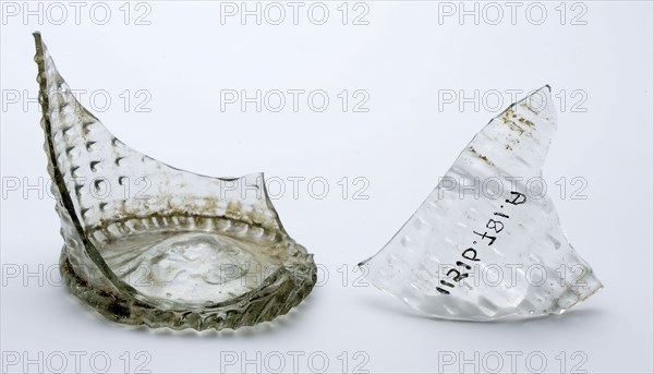 Two fragments of bottom, foot and part of wall of waffle cup, drinking cup drinking utensil holder soil find glass, hand-blown