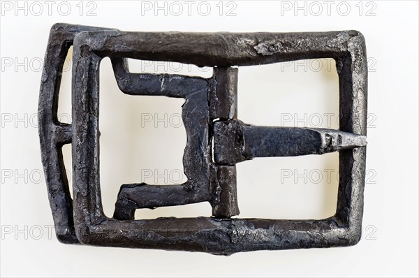 Shoe buckle, rectangular bracket with middle post with angel and bounce, buckle fastener component soil find tin copper? metal