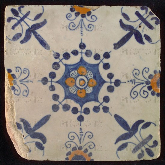 Tile, blue draft and orange on white, central flower within star shape, three-spot around, half rosette, corner motif lily, wall
