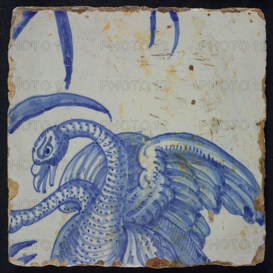 Blue tile with dotted variation on mating swans, of chimney pilaster with 39 tiles, mating swans, ear of corn, leaf, butterfly