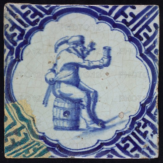 I S, Tile, blue on white, inside scalloped frame man sitting on barrel, cup lifting, corner motif meanders, Wanli, wall tile