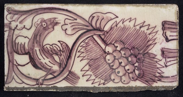 Rectangular edge tile in purple with serpentine decor of leafy tendril, twisted bird to the right, grape bunch, edge tile wall