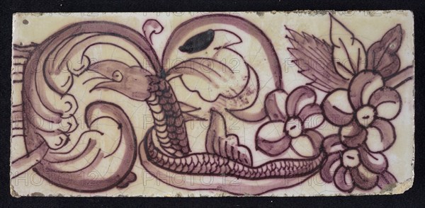 Rectangular edge tile in purple with hinged decor of leaves, flowers and twisted snake with scales and fin, border tile wall