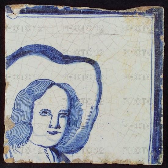 Blue corner tile with male head with hat and frame line above and right, tile picture footage fragment ceramic earthenware glaze