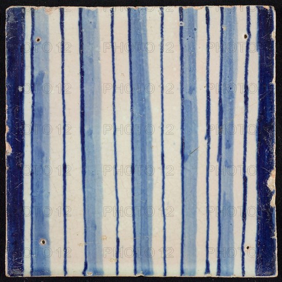 Tile of pilaster, blue on white, part of column with continuous flux, tile pilaster footage fragment ceramic pottery glaze