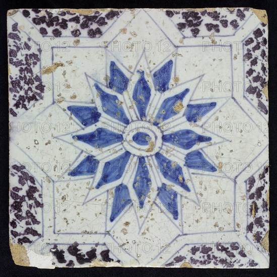 Sprinkled ornament tile, center double circle, double eight-pointed blue star, against background of two white eight-pointed