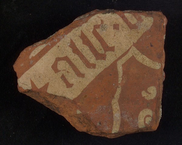 Floor tile, brown and white, wide white band with text in gothic lettering, tile floor tile tile sculpture ceramic earthenware