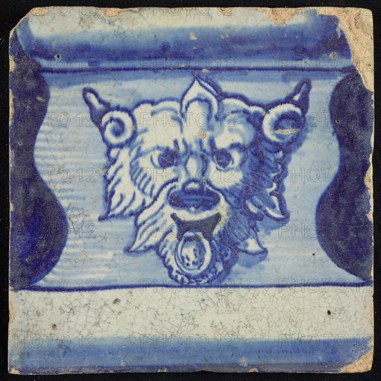 Tile of chimney pilaster, blue on white, part of column with base on which horned lion's head with ring, chimney pilaster tile