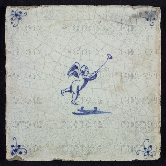 White tile with blue flying putto with wind instrument; corner motif spider, wall tile tile sculpture ceramic earthenware glaze