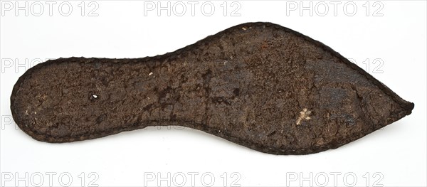 Shoe fragment, consisting of pointy sole of the left shoe, rather small size, sole shoe footwear clothing part soil finding