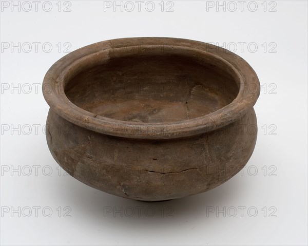 Small brown pot on narrow stand, baluster shape with grooved top edge, Roman pottery, pot holder soil find ceramic pottery, hand