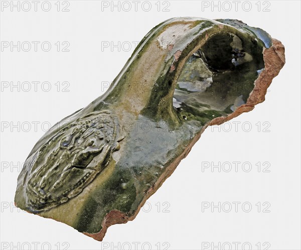 Earthenware fragment with ear and cartouche, green and yellow glazed, fire dome? fragment earthenware pottery earthenware glaze