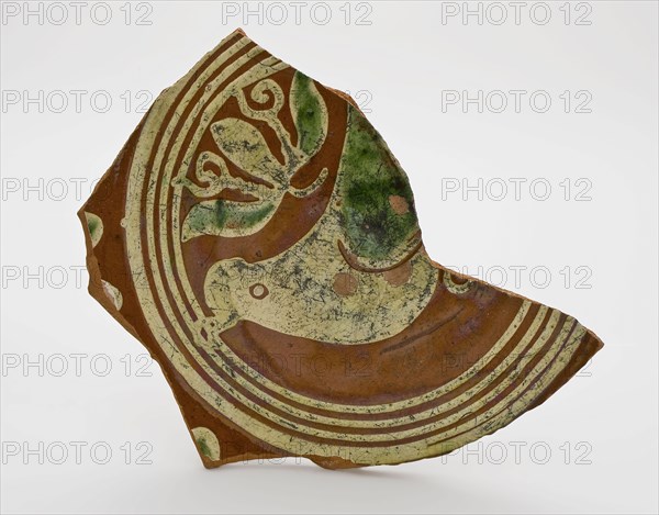 Fragment earthenware dish decorated in sludge technology with circles and bird, dish plate crockery holder soil find ceramic