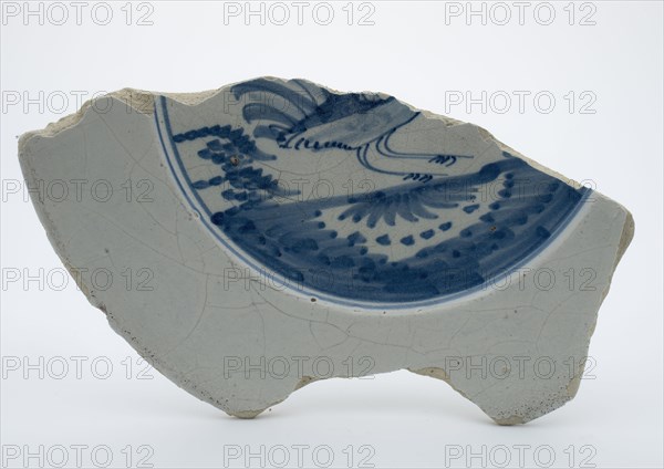 Fragment of faience plate decorated with blue decor, bird, plate crockery holder fragment earthenware pottery earthenware glaze