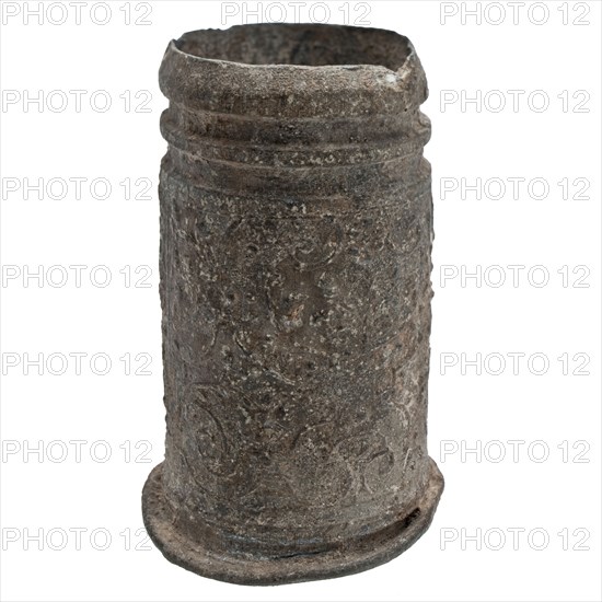 Tin case or cup with decoration of grotesque, candle cup?, tube holder soil find tin metal, cast Tin candle cup with vines