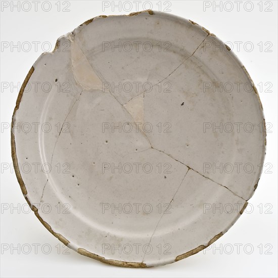 White faience plate on stand, plate crockery holder soil find ceramic earthenware glaze tin glaze, hand turned baked glazed