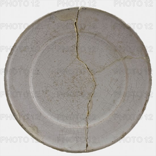 Faience plate on stand surface, entirely white glazed, plate crockery holder soil find ceramic earthenware glaze tin glaze, hand