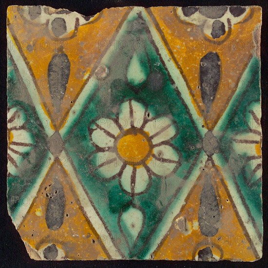 Floor tile, brown draft, green and yellow on white ground, central green oblique glass in which white flower with yellow heart