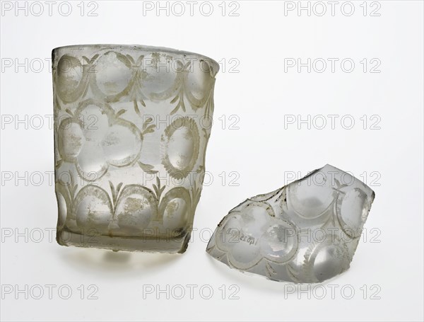 Two fragments of glass cup or drinking glass, conical, sharpened and decorated with radgraving, mug drinking glass drinking