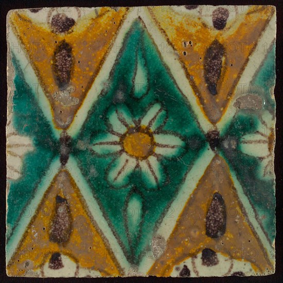 Floor tile, brown draft, green and yellow on white ground, central green oblique glass in which white flower with yellow heart