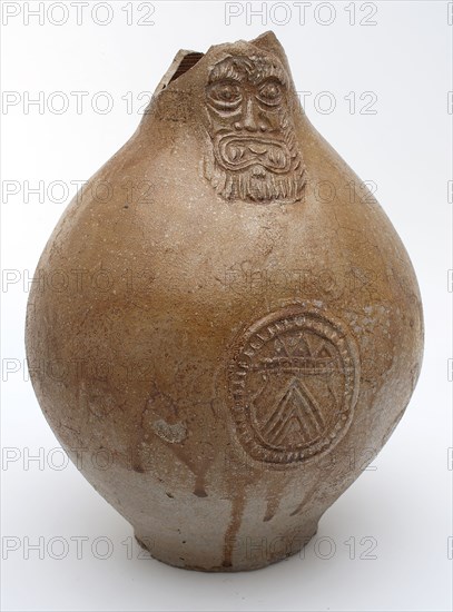 Light brown Bartmann jug, also called Bellarmine jug, under mask oval in which coat of arms, Bartmann jug jug crockery holder