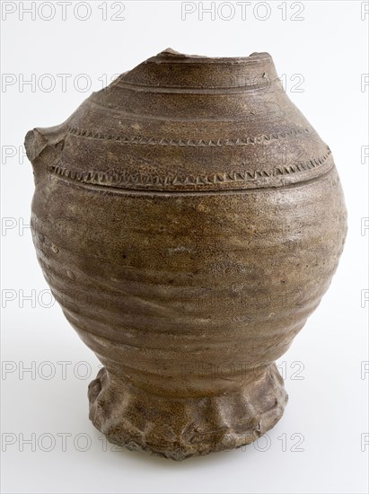Brown stoneware jug with pinched foot, rad-stamp decoration on shoulder, jug crockery holder soil find ceramic stoneware clay