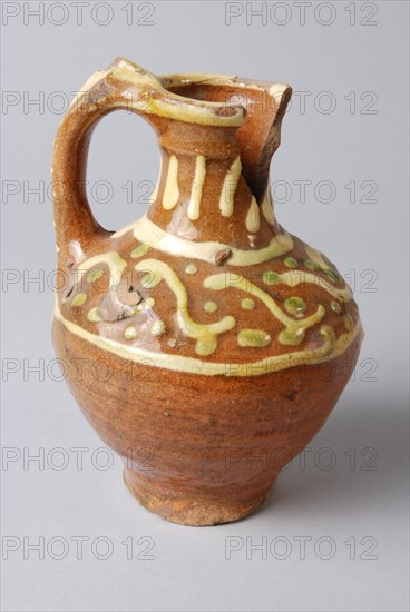 Earthenware oil jug on stand with standing ear and silt decoration on neck and shoulder, oil jug crockery holder soil find
